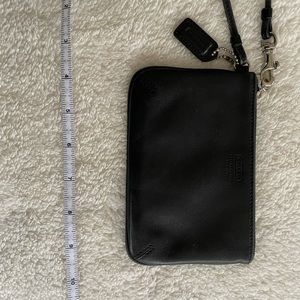 Coach black leather wristlet.